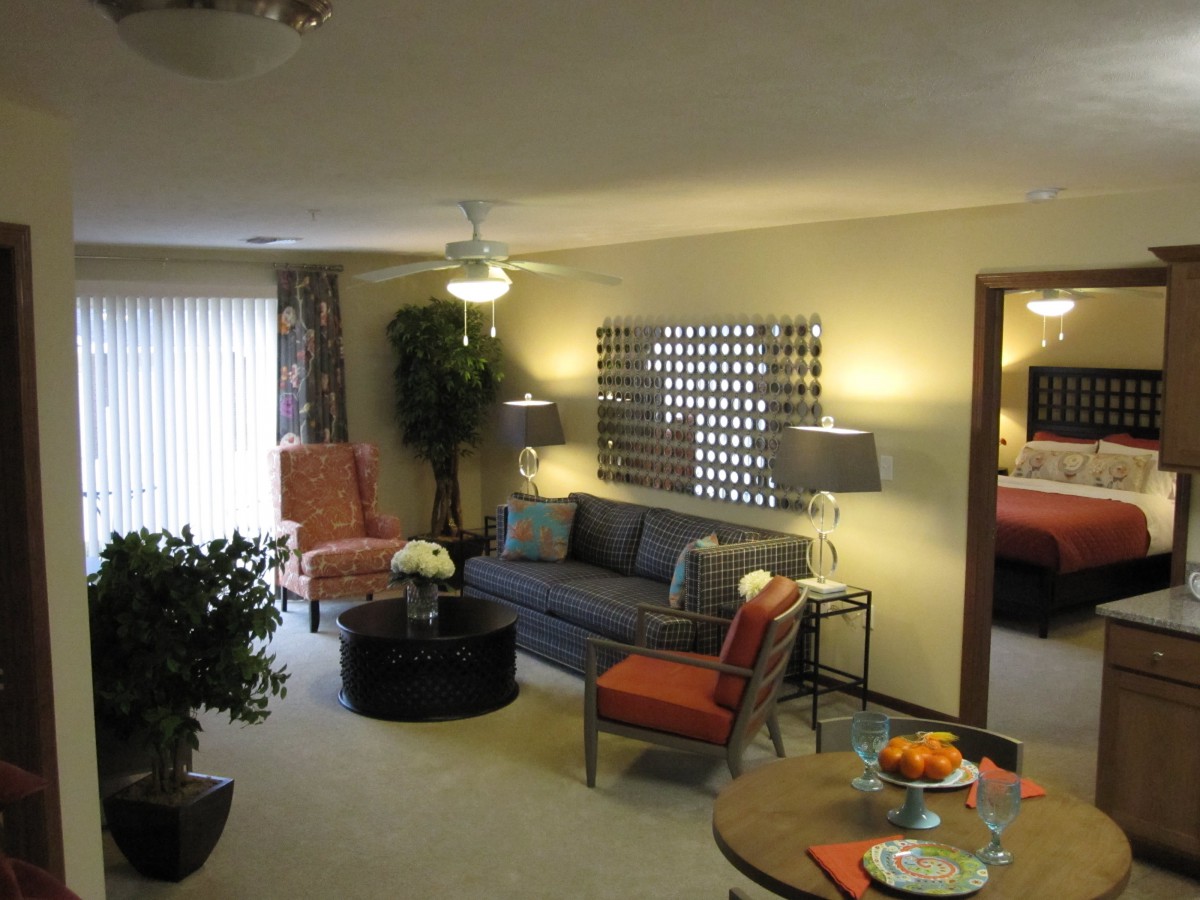 A cozy living room with stylish furniture and decorative elements.