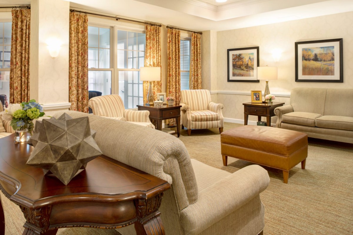 A cozy living room with comfortable seating and warm lighting.