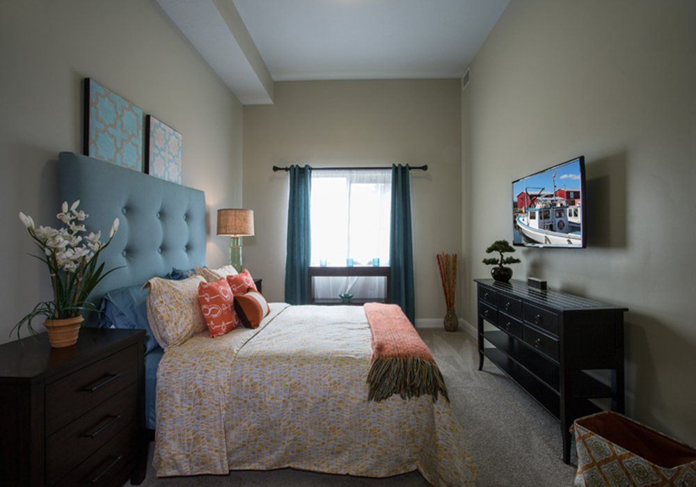 A cozy bedroom with elegant decor and ample natural light.