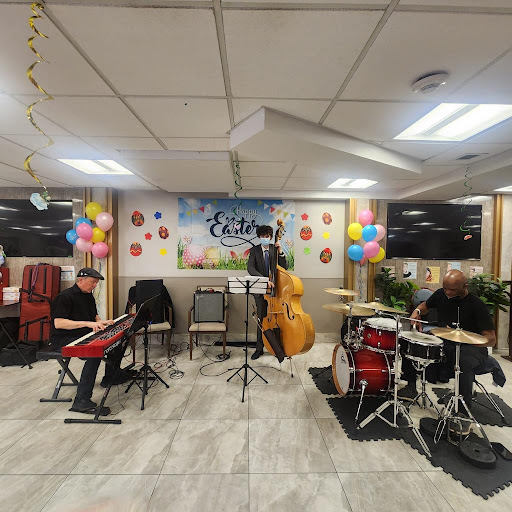 A lively jazz band performing at an indoor celebration, complete with colorful decorations.