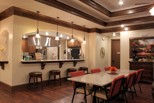A cozy dining area featuring modern furnishings and warm lighting.