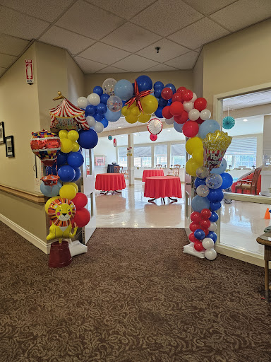 A vibrant balloon archway welcoming guests to an event.