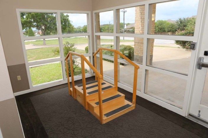 Indoor rehabilitation stairs used for physical therapy exercises.