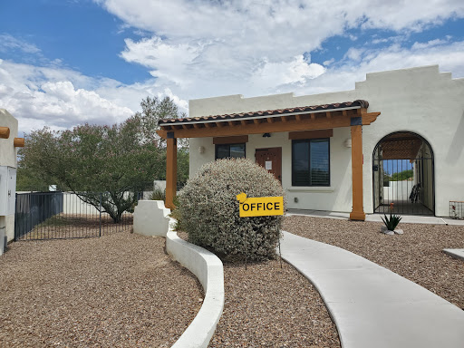 A welcoming office with a distinct landscaping design in a desert setting.