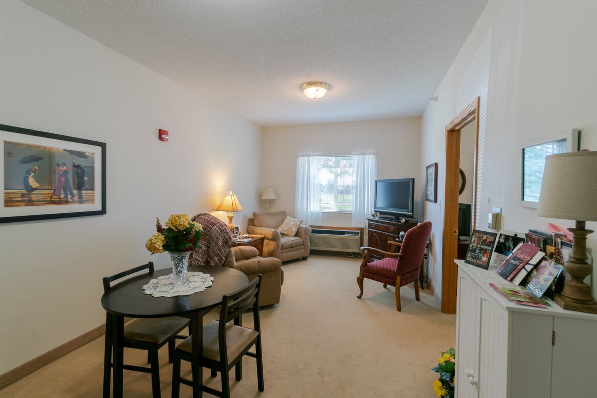 Cozy living room with a small dining area and comfortable seating.