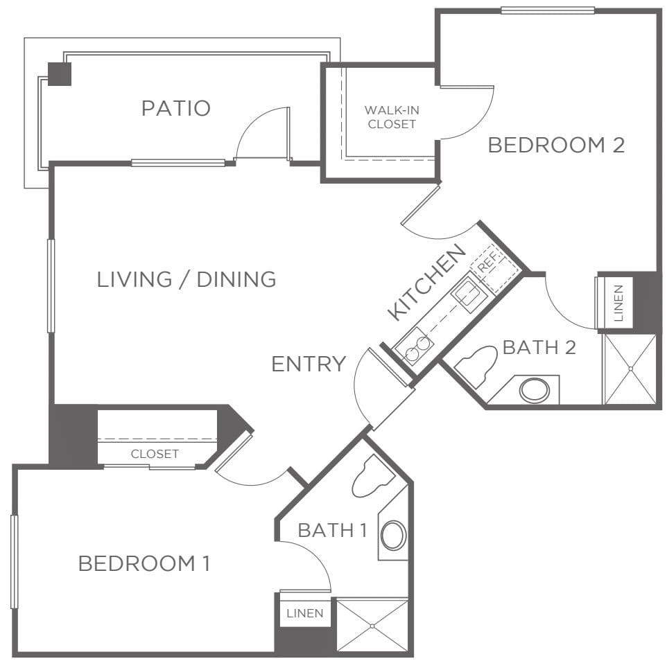 A floor plan of a two-bedroom apartment with designated areas for living/dining, kitchen, two bathrooms, and a patio.