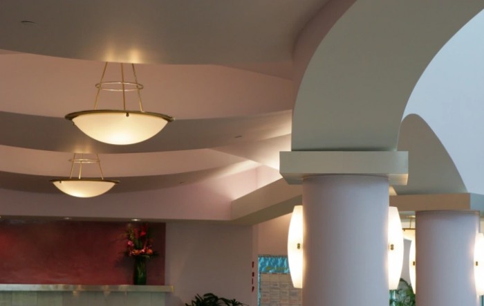A modern interior featuring soft lighting and architectural columns.