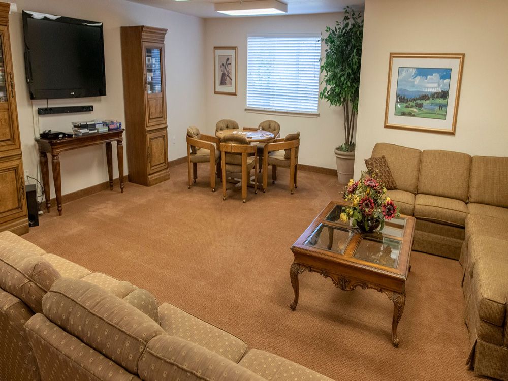 A cozy living room with comfortable seating and tasteful decorations.