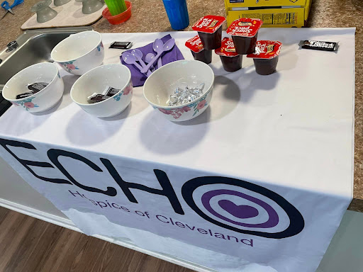 A table set up with snacks and treats for a community event.