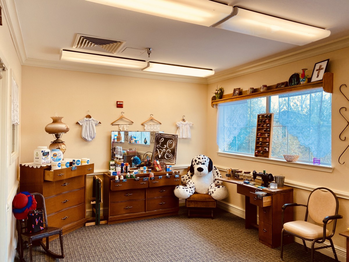 A cozy office space with decorative items and plush toys.