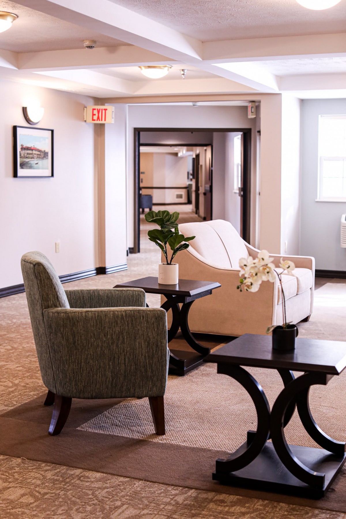 A cozy lobby seating area with comfortable chairs and stylish decor.