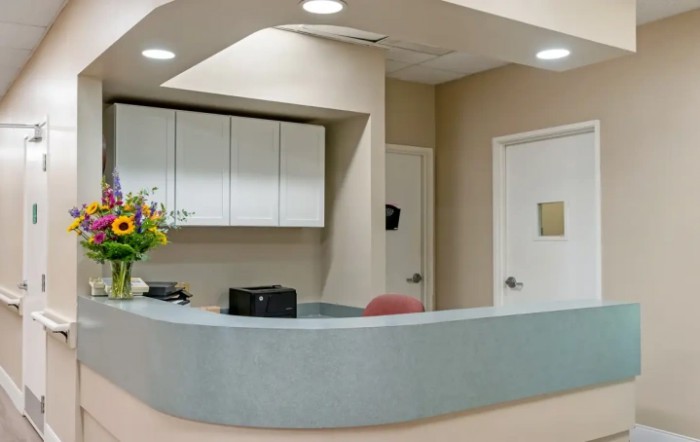 A clean and modern reception desk in a medical office setting.