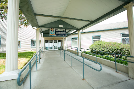A welcoming entrance with a ramp leading to the building, providing accessibility.