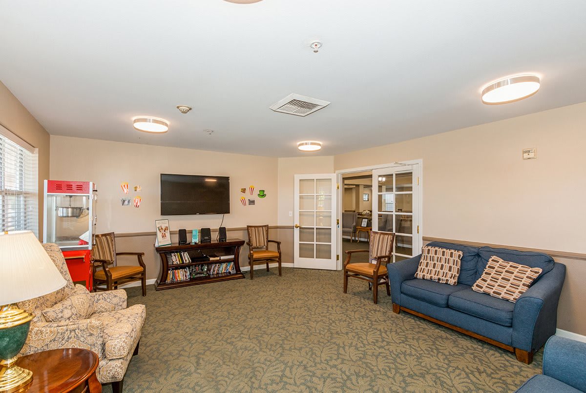 A cozy living room with comfortable seating and a television, designed for relaxation.