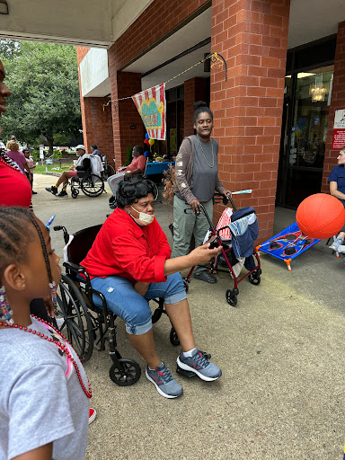 A vibrant community gathering where individuals of all ages come together to share smiles and experiences.