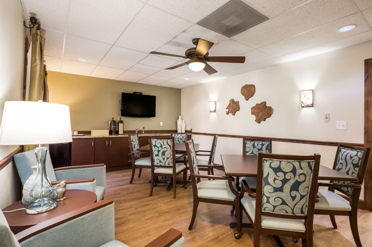 A cozy dining area with elegant furniture and warm lighting.