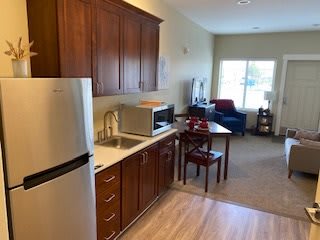Modern apartment interior with kitchen and living area.