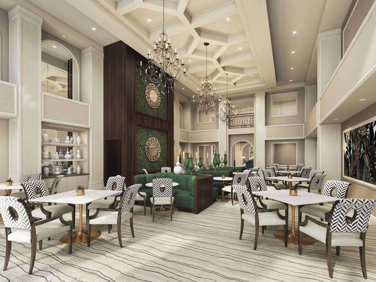 An elegant restaurant interior with luxurious decor and chandeliers.