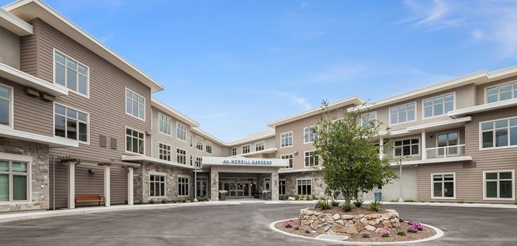 A modern building with a welcoming entrance and well-maintained landscaping.
