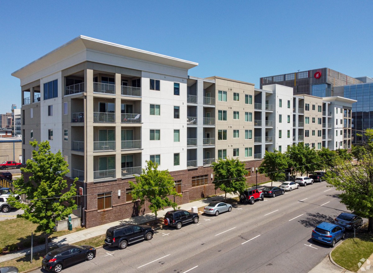 A modern residential apartment building along a city street.