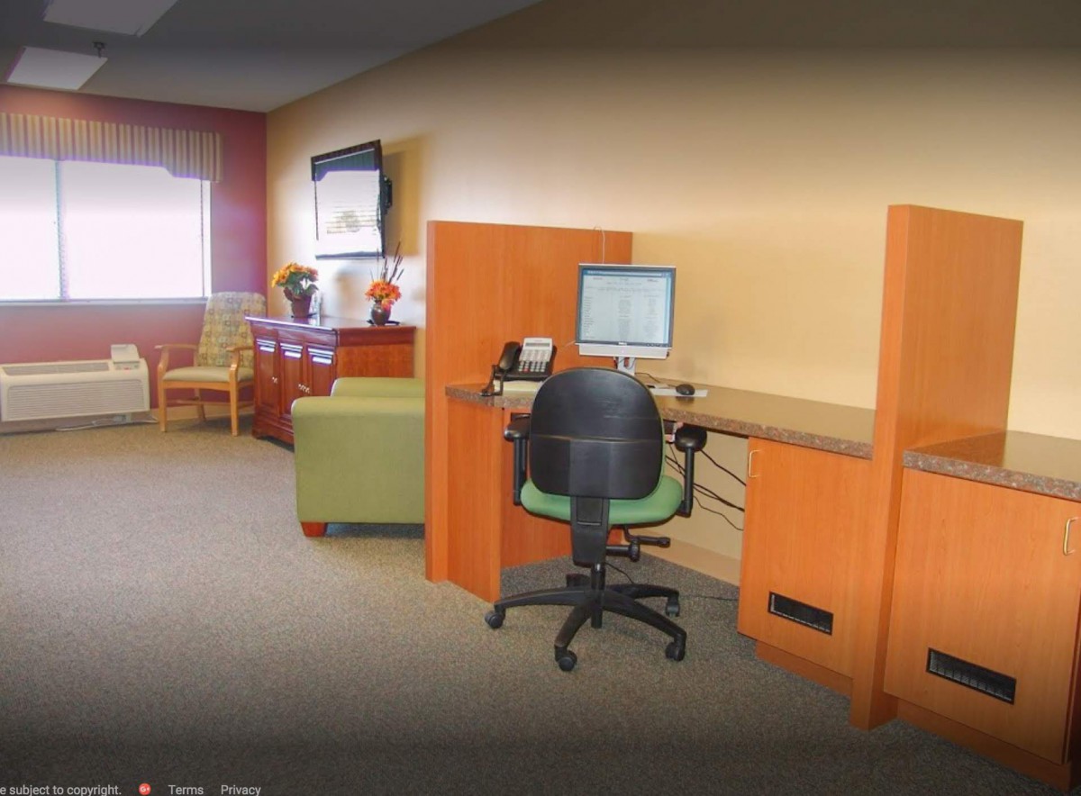 A modern office workspace with desks and computers.