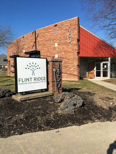 Exterior view of the Flint Ridge building with a prominent sign.