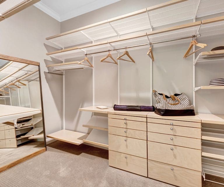 A spacious walk-in closet with minimalist design and ample storage space.