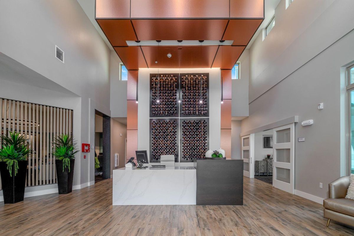 A modern reception area with a sleek desk and contemporary decor.