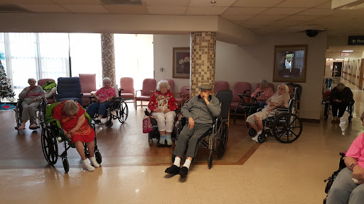 Elderly residents participating in a community gathering at a care home.