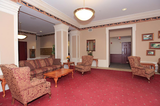 A cozy lobby area featuring comfortable seating and warm decor.