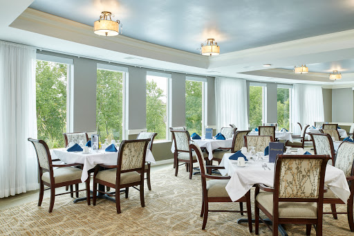 A beautifully arranged dining area with elegant decor and natural light.