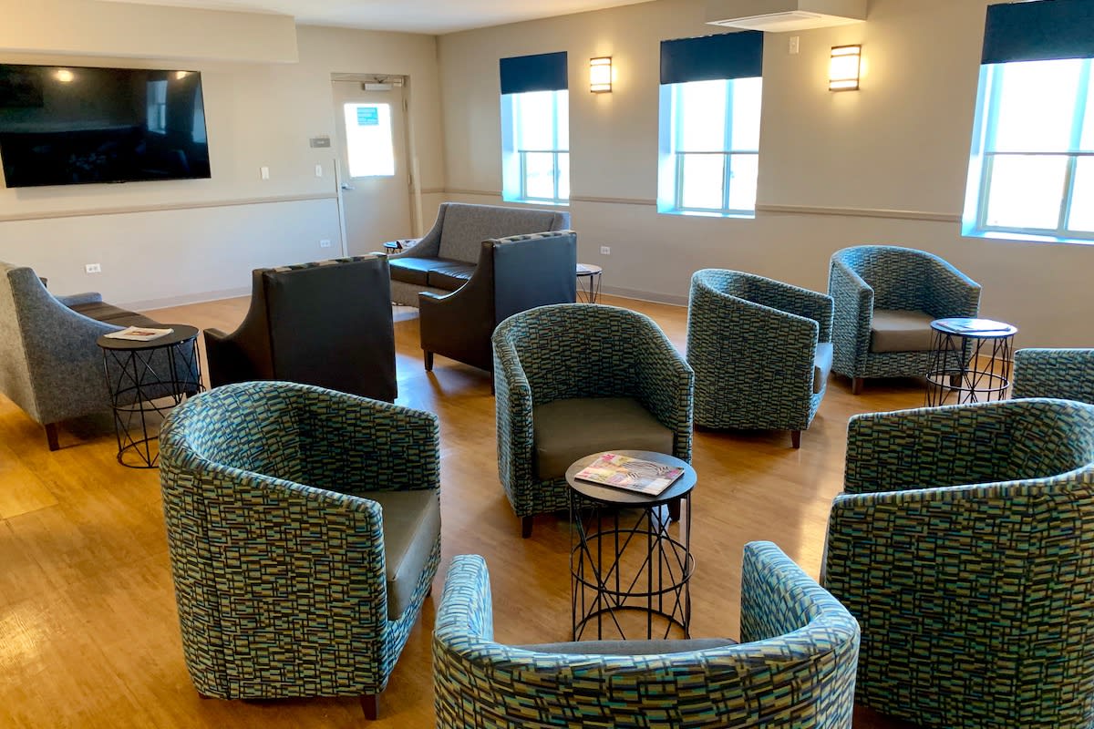 A modern lounge area with comfortable seating and tables.