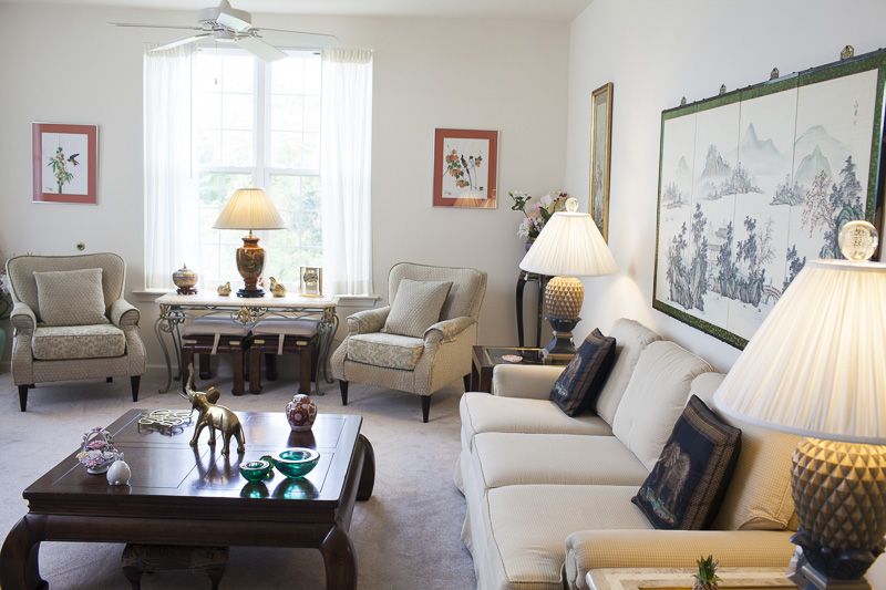 A cozy living room with comfortable seating and tasteful decorations.