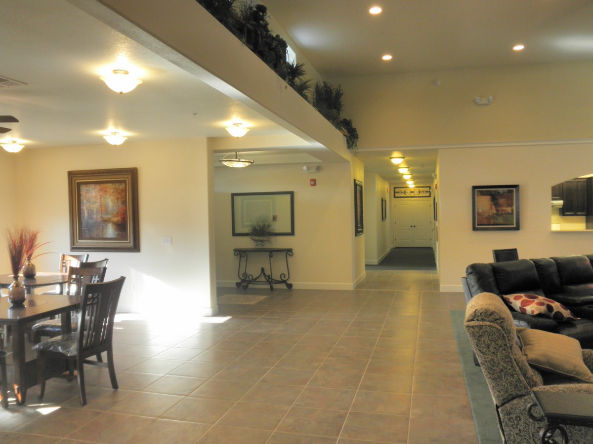 Spacious interior with comfortable seating and artwork on the walls.