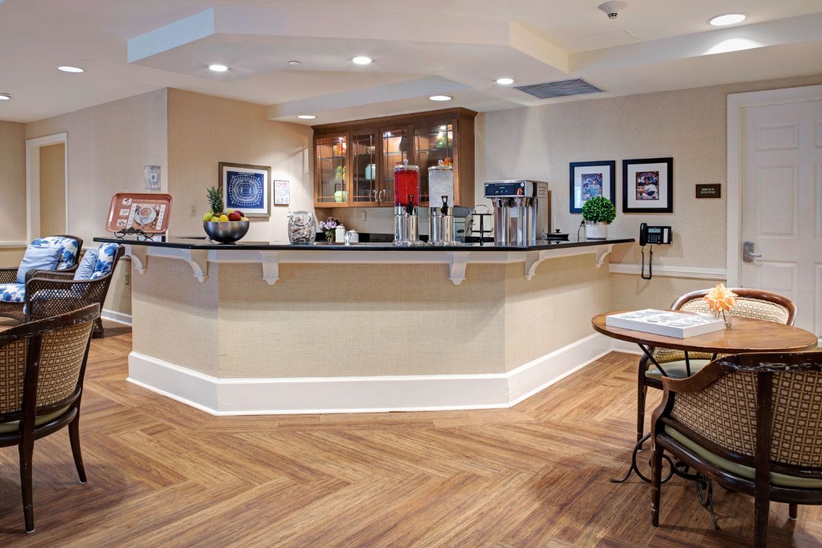 A modern kitchen interior featuring a stylish countertop and wooden flooring.