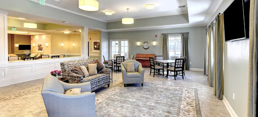 A cozy and inviting lounge area featuring comfortable seating and warm lighting.