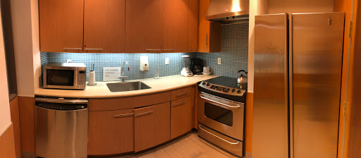 A modern kitchen featuring sleek cabinetry, stainless steel appliances, and a stylish countertop.