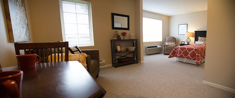 A well-lit living room with modern furniture and decor.