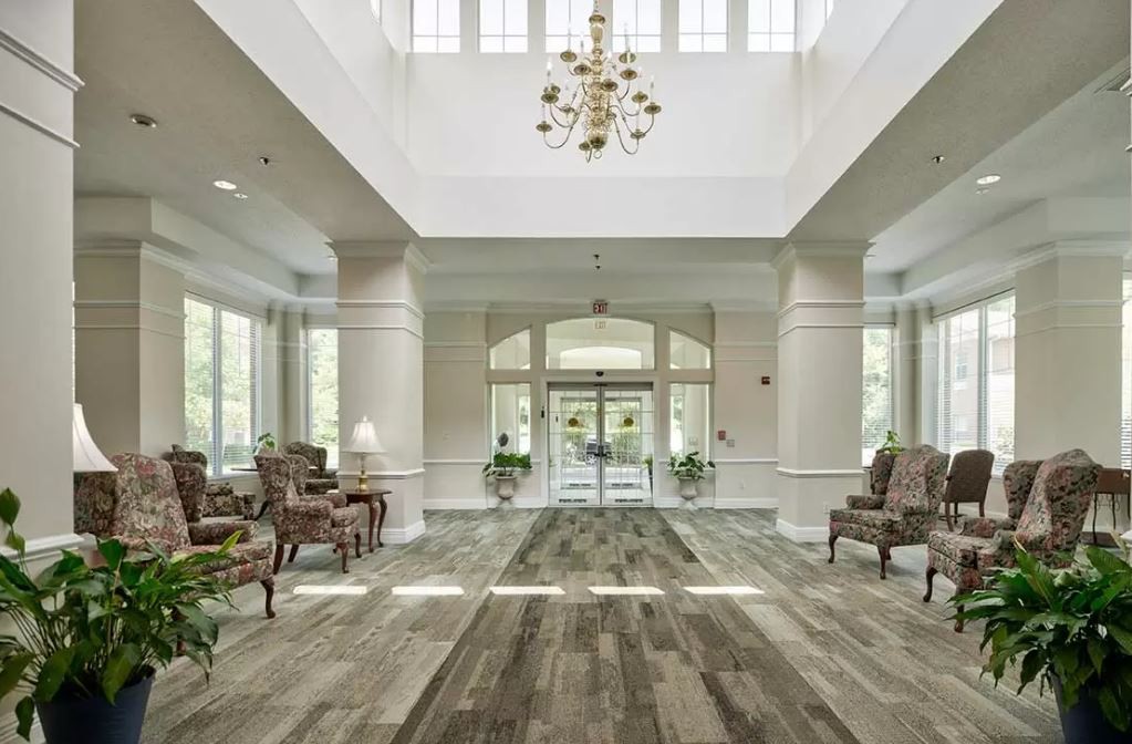 Elegant lobby area with chandelier and comfortable seating.