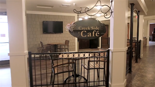 The inviting entrance to the 'Caf' area, featuring a cozy seating arrangement.