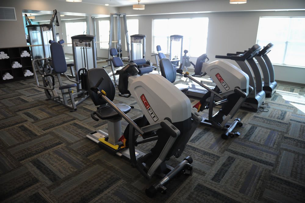 A gym equipped with various exercise machines.
