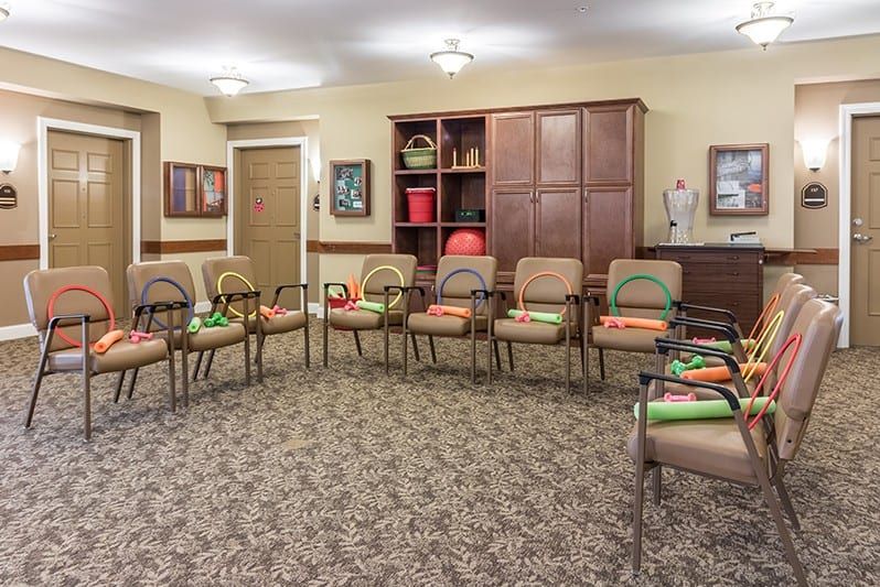 A well-organized meeting room with chairs arranged in a circle.