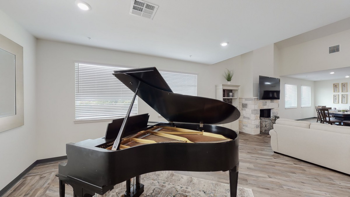 A grand piano in a modern living room setting.