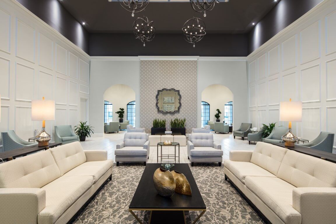 A luxurious and modern living room with elegant furniture and decor.