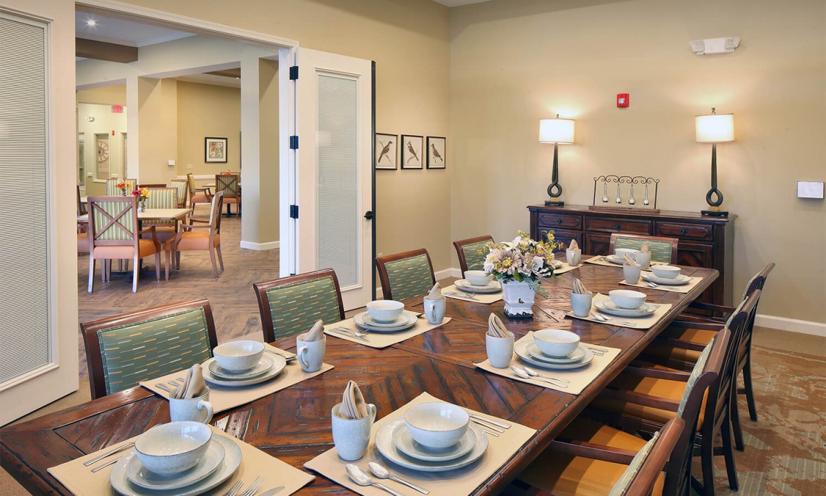 A beautifully set dining table in an elegant dining room.