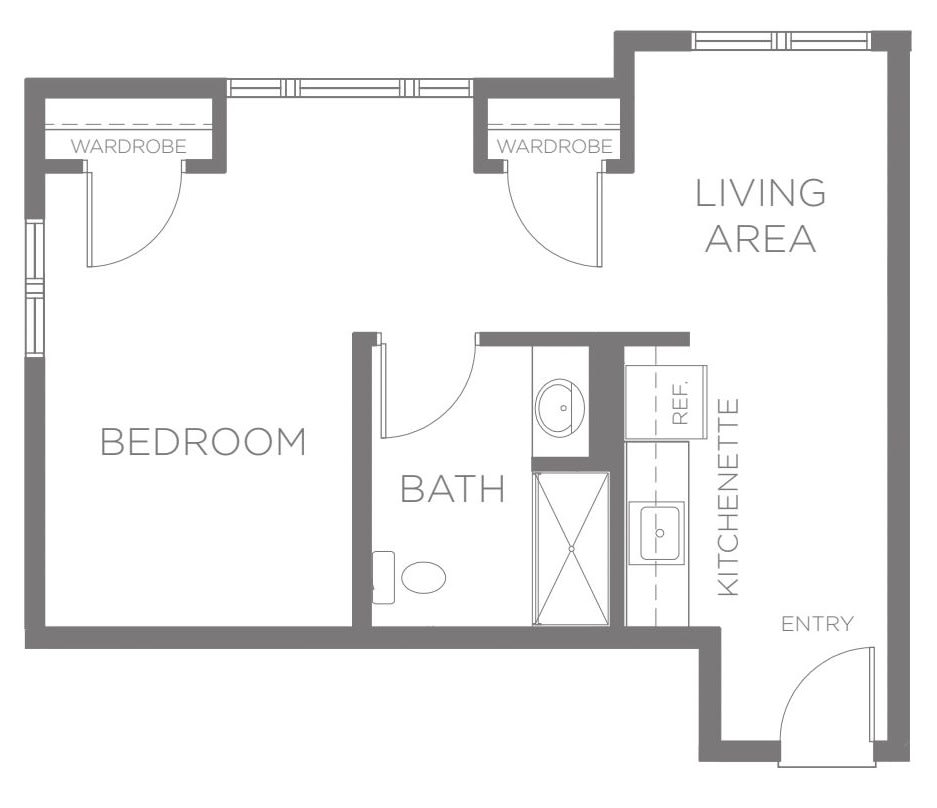A simple floor plan showing a one-bedroom apartment with a living area, bedroom, bathroom, and kitchenette.