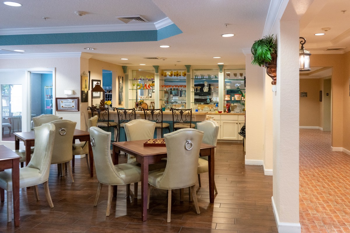 A cozy dining area with neatly arranged tables and chairs, offering a warm and inviting atmosphere.