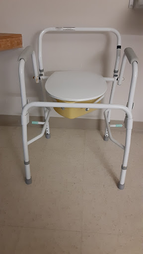 A commode chair designed for individuals with mobility challenges.