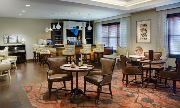 A cozy restaurant and bar area with comfortable seating and elegant decor.