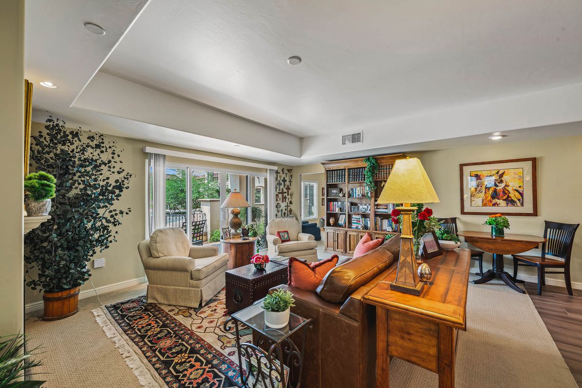 A cozy and well-decorated living room with comfortable seating, stylish furnishings, and ample natural light.